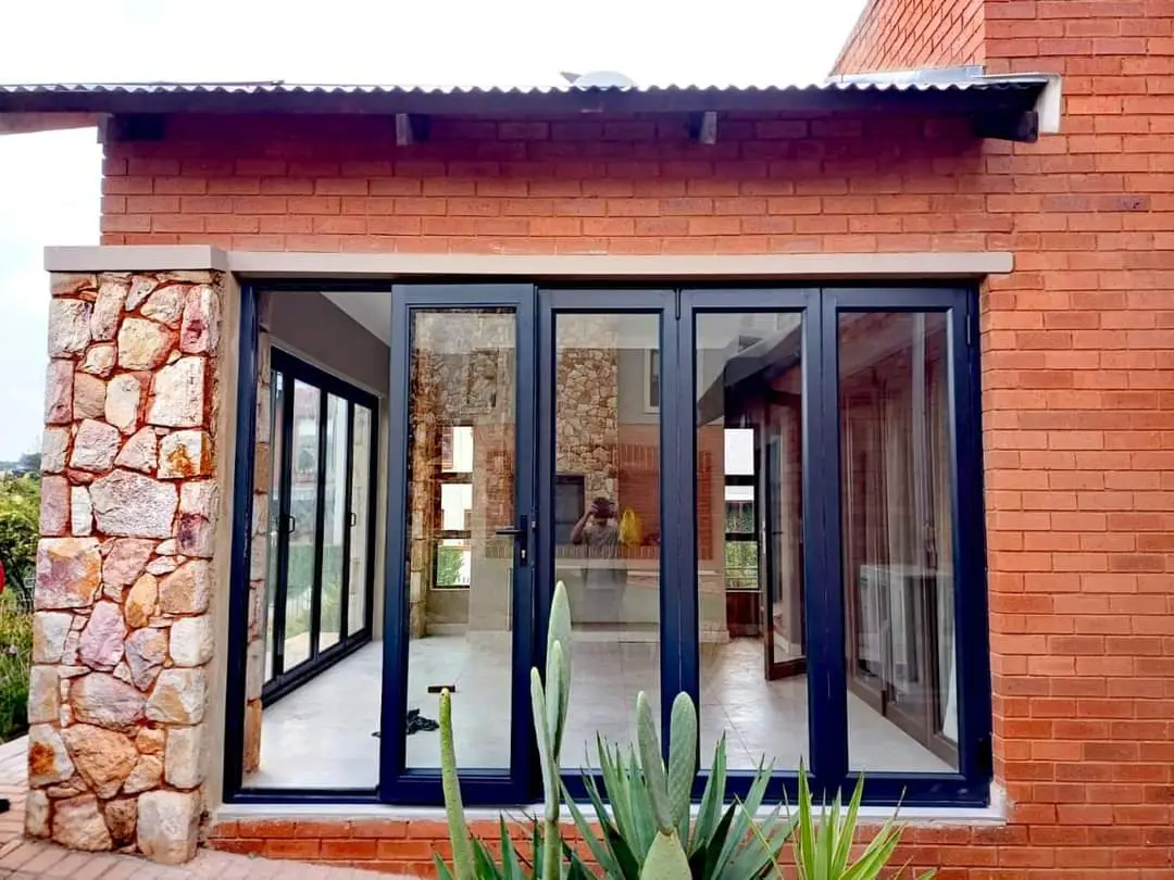 Wide folding glass doors opening a living area to the outdoors
