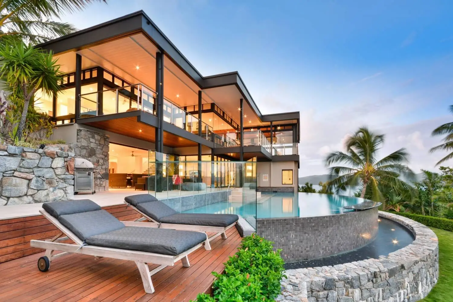Contemporary home with expansive glazing opening onto an outdoor terrace